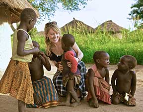 Bethany Williams smiles at children.