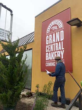 The sign outside the Grand Central Bakery, "coming soon."