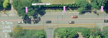 The new sidewalk section on 143rd will be next to the
roadway but will be separated by a curb.
