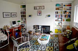 The comfortable reception area helps clients feel welcome, with toys for kids and books to borrow
