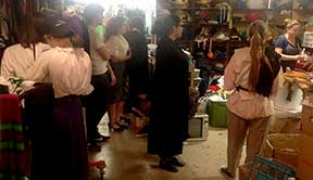 The costume room is a hive of activity in a basement room under the stage
