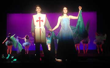Sir Lancelot, played by Oskar Linde, and The Lady of the Lake, Jessica Caldwell, share a beautiful duet while chorus &ldquo;cheerleaders&rdquo; dance in the background.