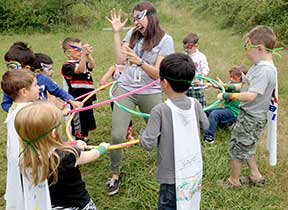 Children playing with hula hoops.
