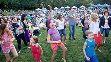 Children dancing at concert.