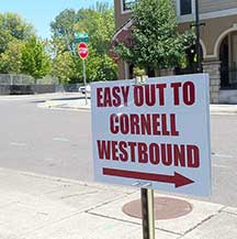 A sign in the Foot Traffic parking lot directs people to drive through the neighborhood.