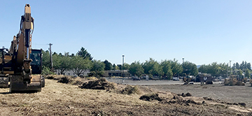Grading is finally underway. This upper section will include parking for the Sunset Athetic expansion and the shops and offices on the second floor of the east building.