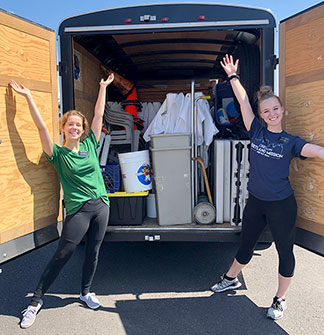 Volunteers help set up the market and get a workout having fun!