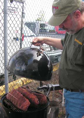 John Roberts tends ribs
