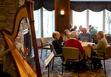 laurel parc residents enjoying harp music