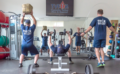 firefighters working out in gym