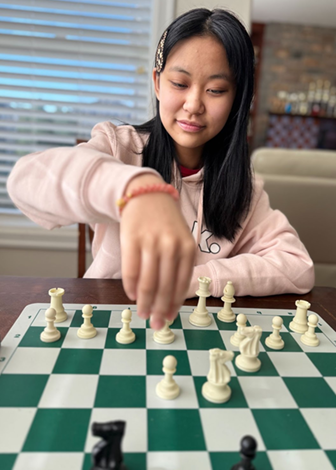 zoey tang playing chess