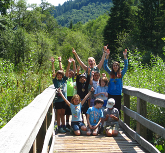 nature campers on a bridge