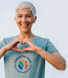 person making heart shape with hands